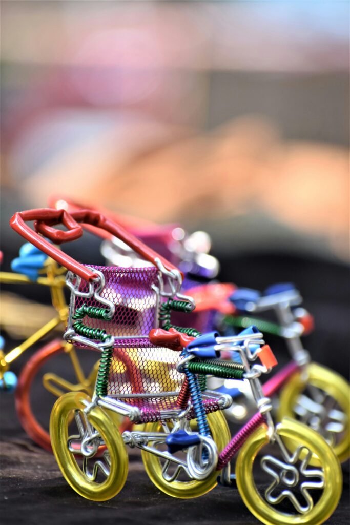 Vibrant wire bicycles showcase creativity with colorful designs, perfect for playful decor.
